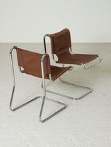 Cadires Cantilever de tub cromat i lona