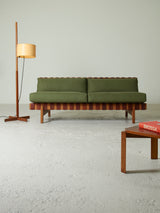 Sofà de fusta i cinxes de cuir