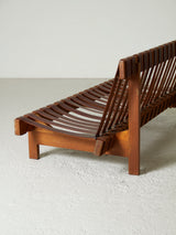 Sofà de fusta i cinxes de cuir