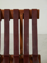 Sofà de fusta i cinxes de cuir