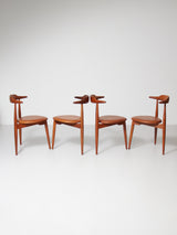 Juego de cuatro sillas de madera y piel