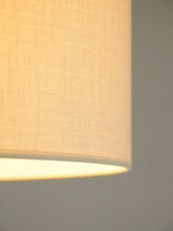 Llum de peu de ferro negre, bronze i pantalla de lli