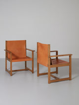 Pareja de sillones de roble y cuero