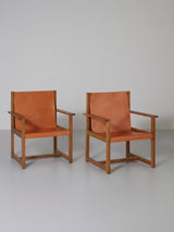 Pareja de sillones de roble y cuero