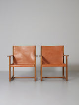 Pareja de sillones de roble y cuero