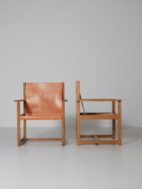 Pareja de sillones de roble y cuero