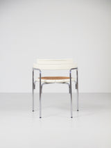 Juego de cuatro sillas de tubo de acero y ratán