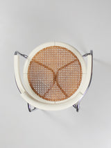 Juego de cuatro sillas de tubo de acero y ratán