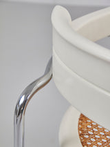 Juego de cuatro sillas de tubo de acero y ratán