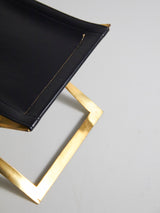 Taburete plegable en hierro y piel negra