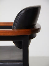 Pareja de sillones de hierro, madera y skay