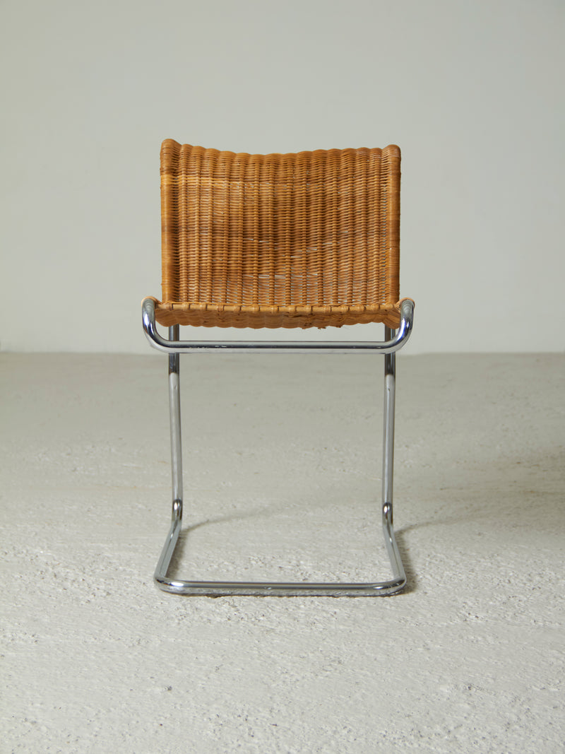 Cantilever chair made of chrome tube and wicker